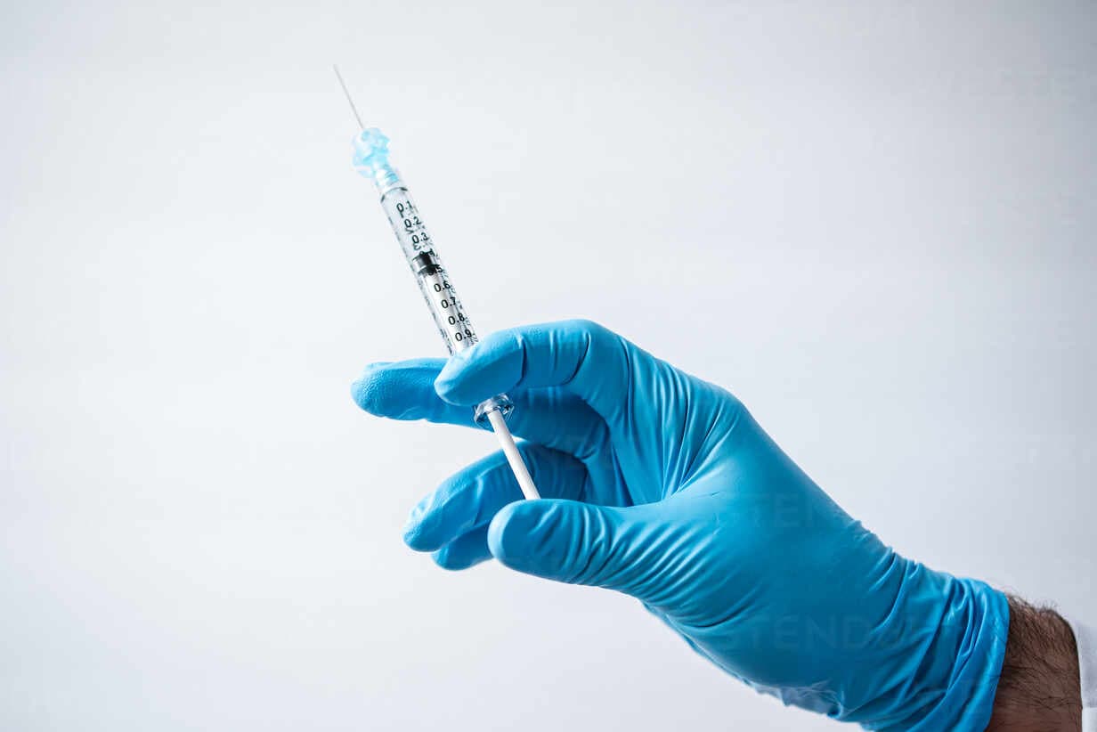 Medical professional preparing an injection